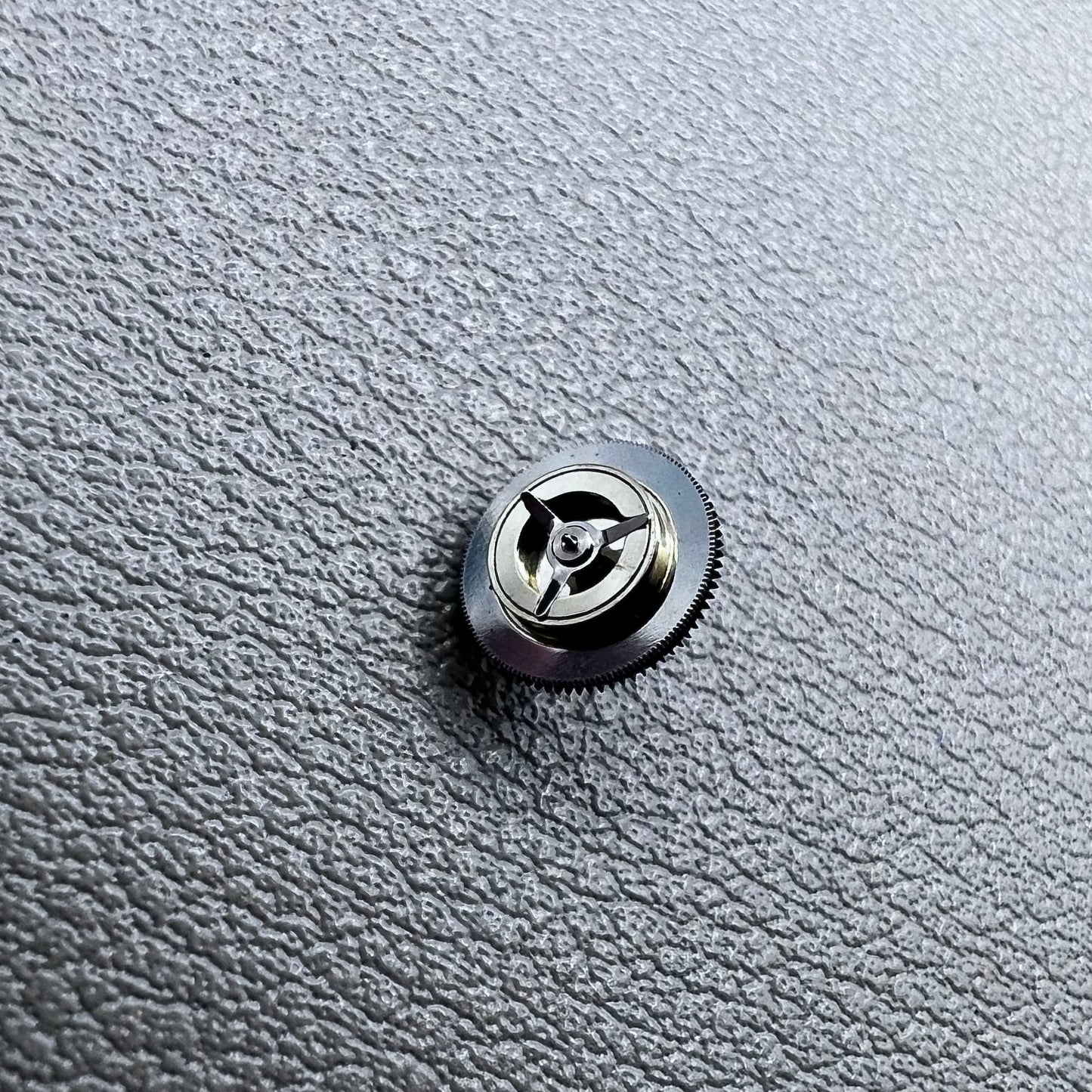 Black counting wheel for ETA C01.211 watch movement, precision replacement part for watch repair.
