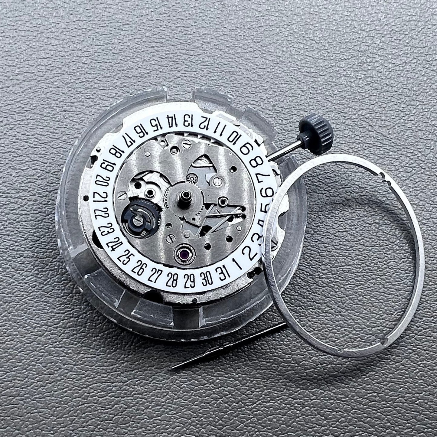 Japan Miyota 8215 silver plated automatic watch movement with date at 6 o?clock, precise mechanical design.