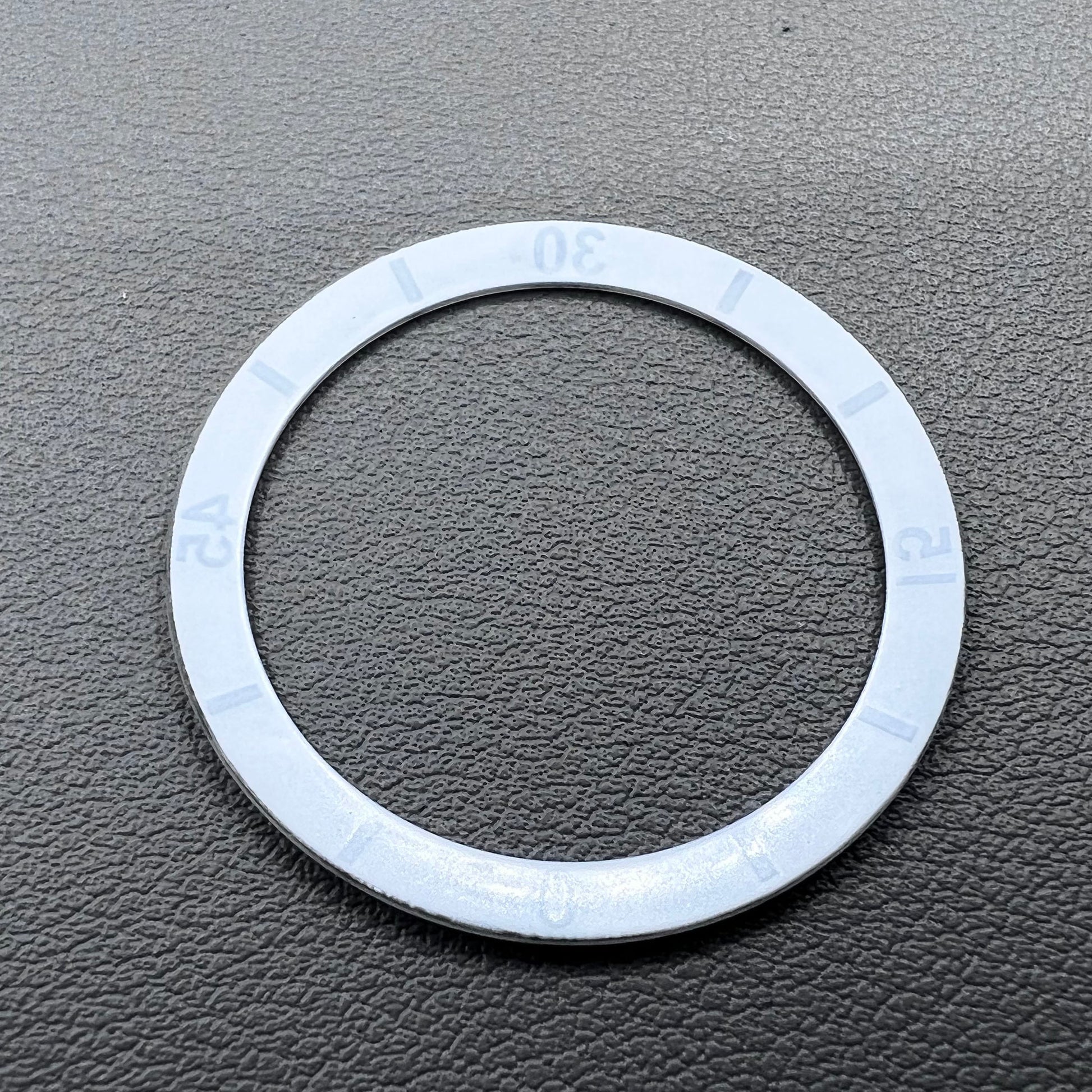 White 36mm ceramic watch bezel insert with numeral markings for men's and women's watches.