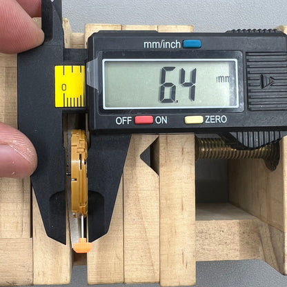 Japan Miyota GP00 quartz watch movement close-up, precision timekeeping mechanism for watches.