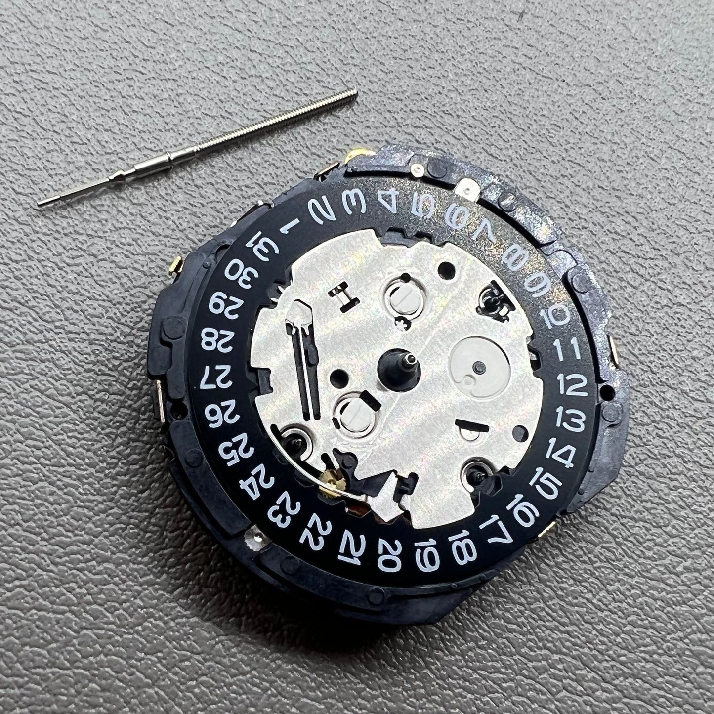 Seiko 7T85A quartz watch movement, precise craftsmanship made in Japan for reliability.