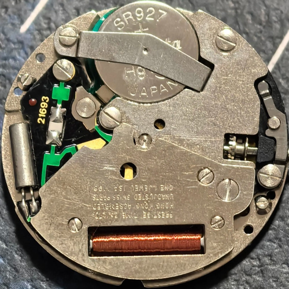 Swiss Made ISA 1198 quartz watch part with day-date display and three-hand movement for precise timekeeping.