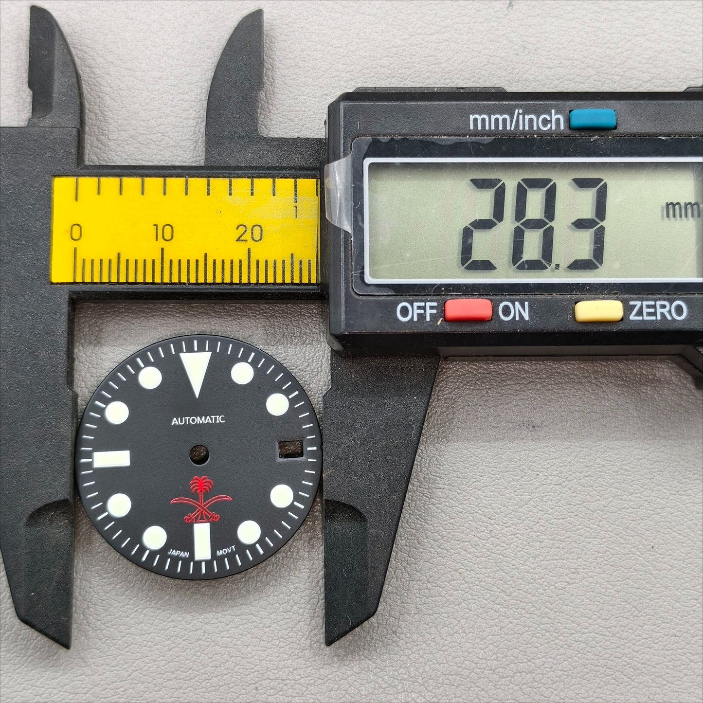 watch dial with S logo