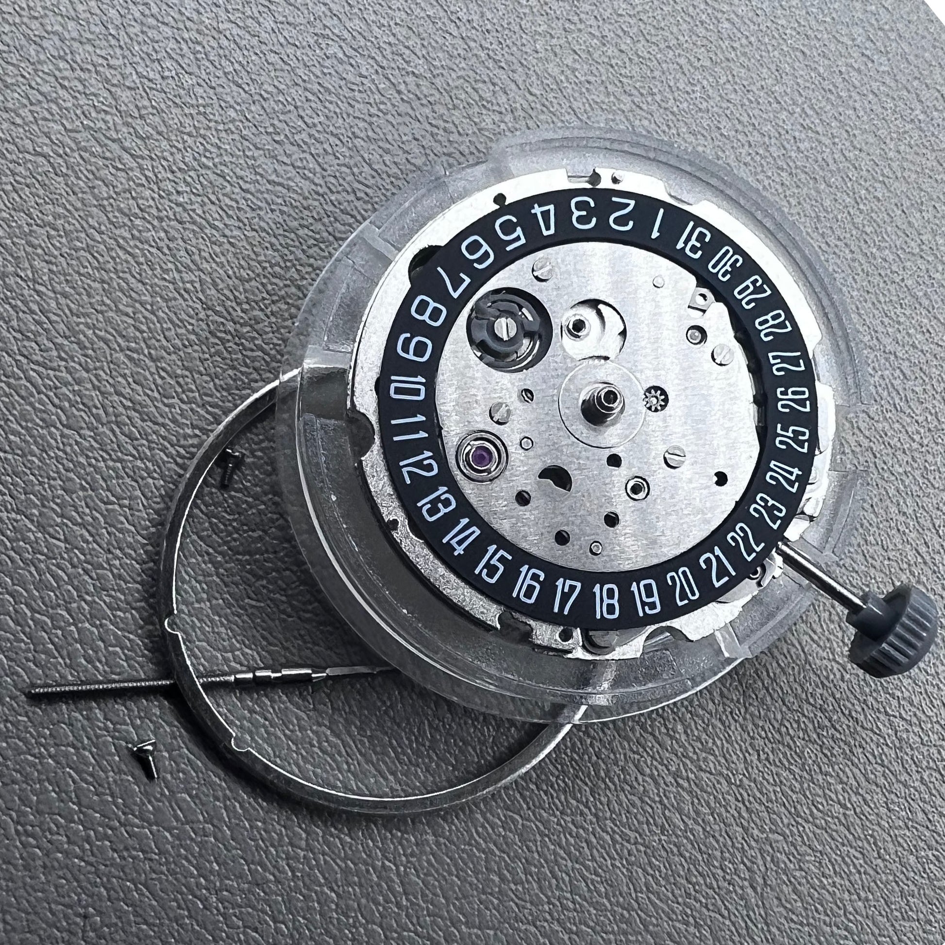 Japan Miyota 8215 automatic watch movement with black dial and date display at 6 o'clock by Miyota.