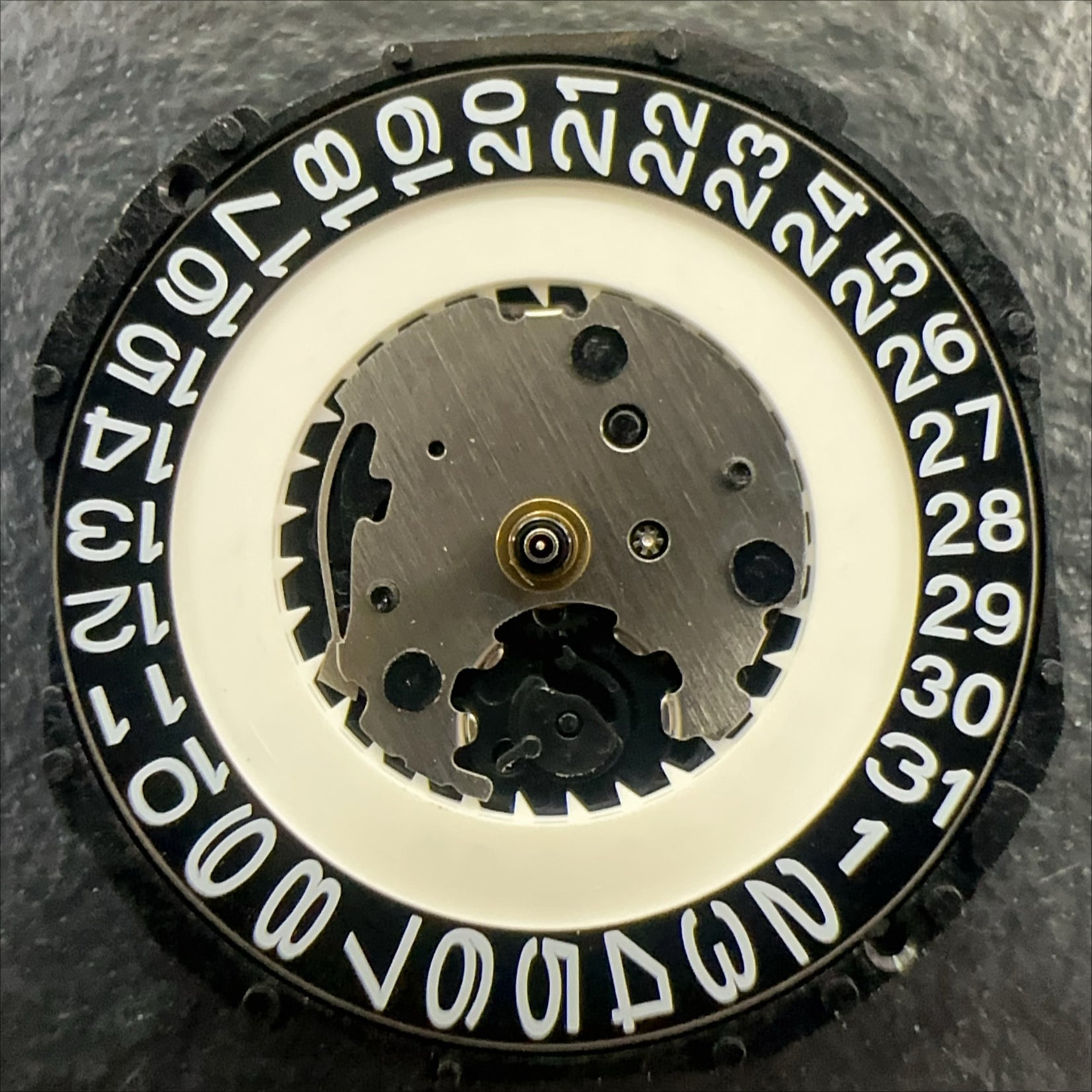 PC32A quartz watch movement with single calendar, black date disk at 3 o'clock by Japan Made brand.