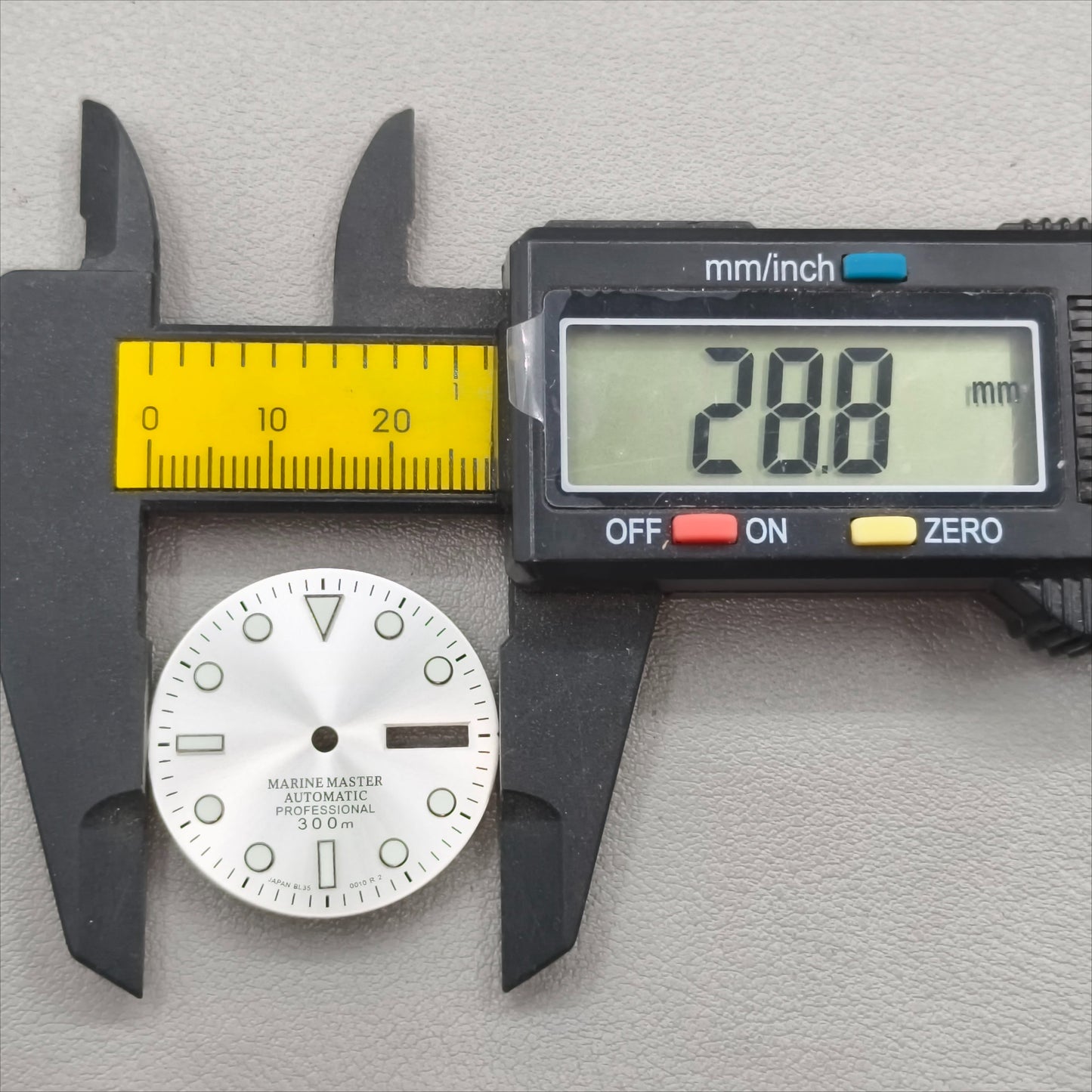 watch dial with S logo