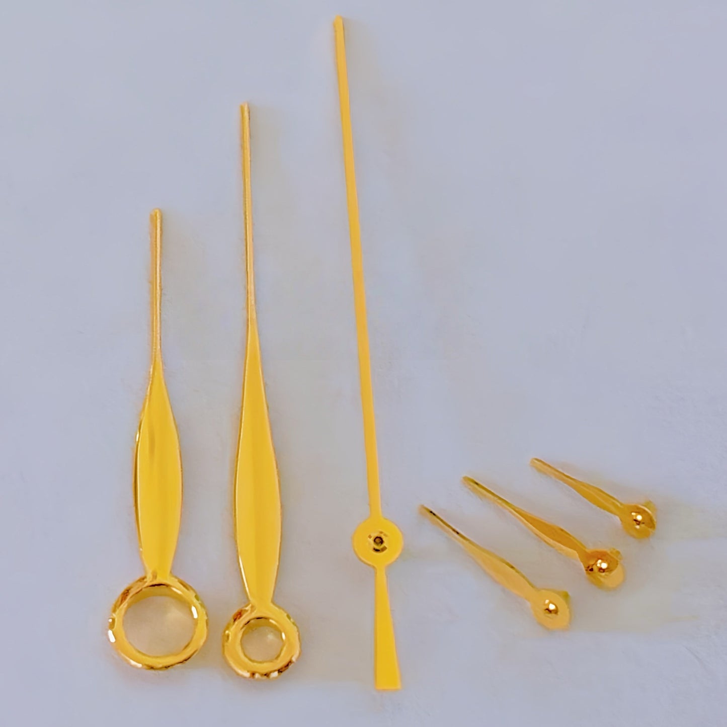 Golden leaf-shaped watch hands for ETA/Dandong 7750 movement, ideal for precise watch repairs.