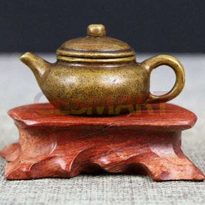 Solid copper teapot trinket, vintage hand-carved bronze figurine, detailed craftsmanship.