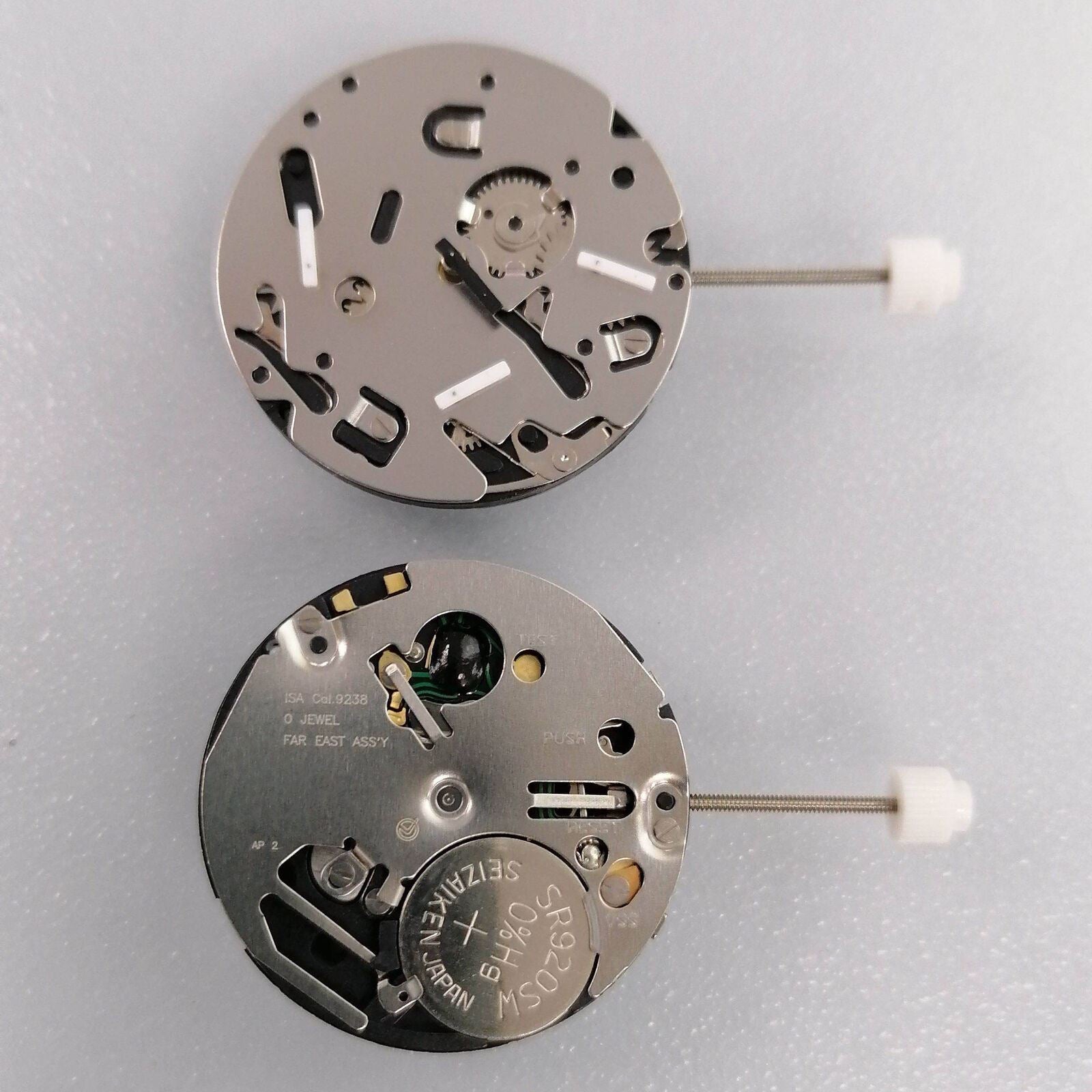 Watchmakers ISA 9238 quartz movement replacement part for watch repair, silver finish.