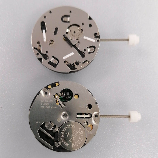 Watchmakers ISA 9238 quartz movement replacement part for watch repair, silver finish.