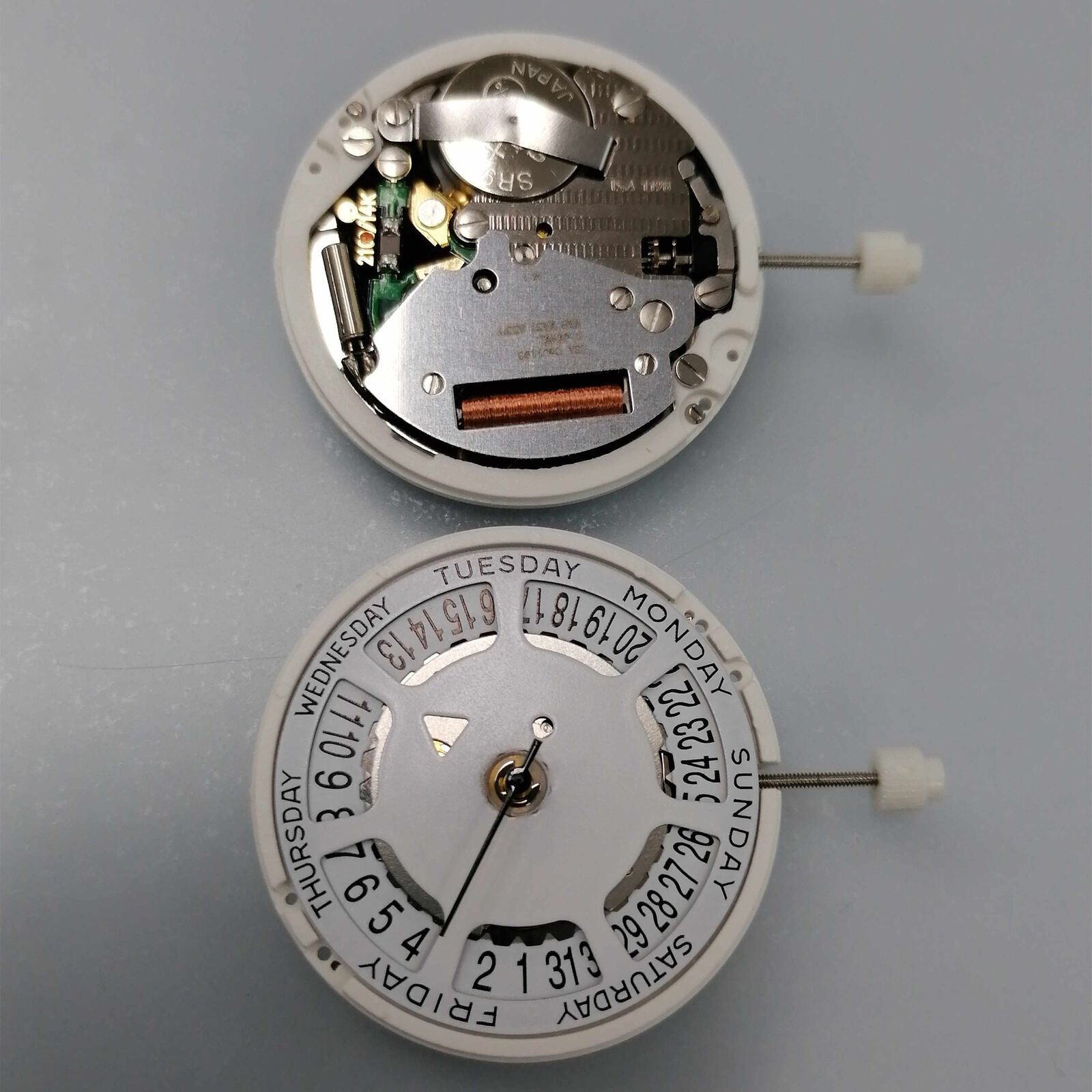 Watchmakers ISA 1198 quartz day-date watch movement with white dial, date at 6 position, replacement part.