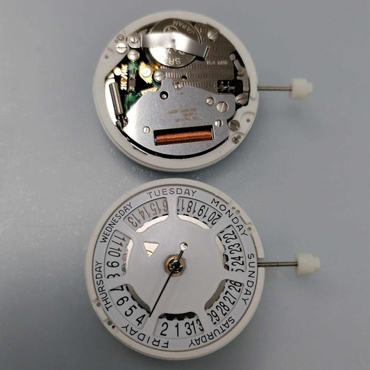 Watchmakers ISA 1198 quartz day-date watch movement with white dial, date at 6 position, replacement part.