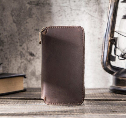 Brown leather 2-slot watch box, portable zipper pouch for secure luxury watch storage and travel.