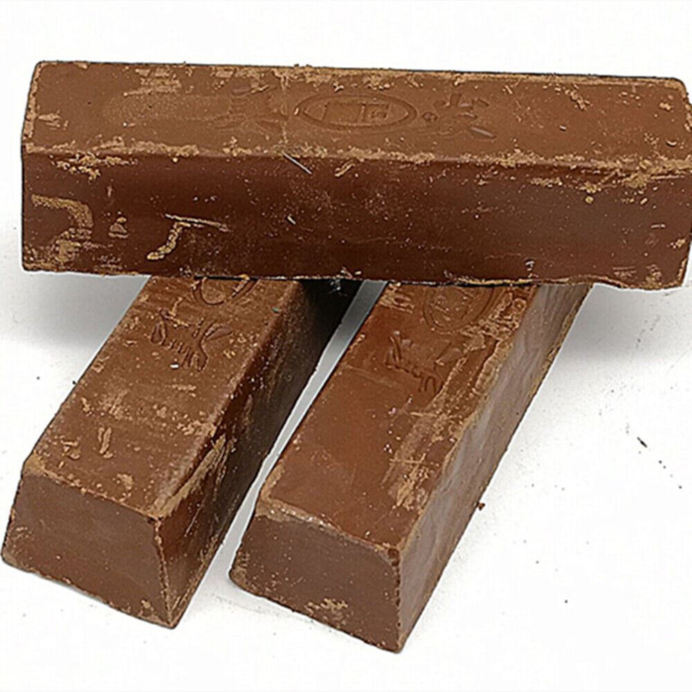 Brown stainless steel polishing compound for jewelry and watch repair, restores shine efficiently.