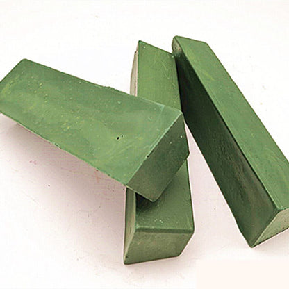 Green stainless steel polishing compound for jewelry and watch repair, restoring shine and removing tarnish effectively.