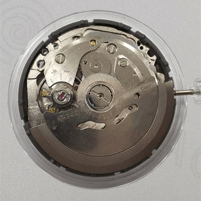 Miyota NH36A watch movement with black finish and green lume on dial, showcasing 3 crown positions for precise time setting.