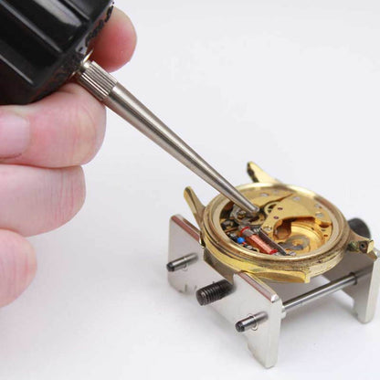 Bergeon 30540 Bakelite blower removing dust from watch components for precise cleaning.