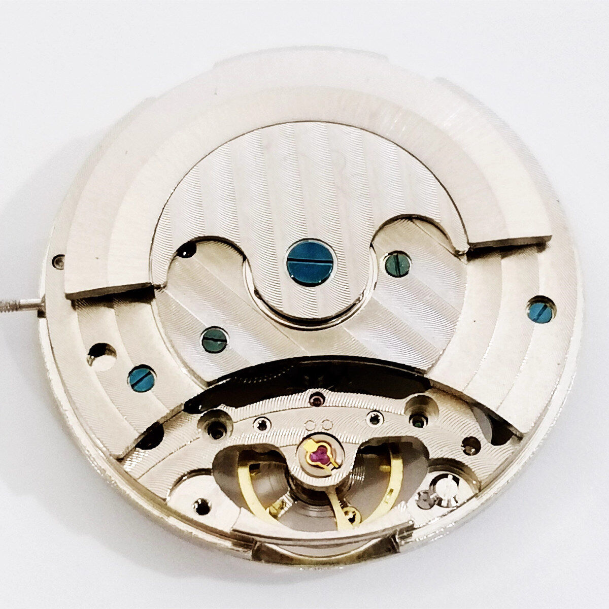 Dandong Silver automatic watch with intricate carved design and visible mechanical movement.