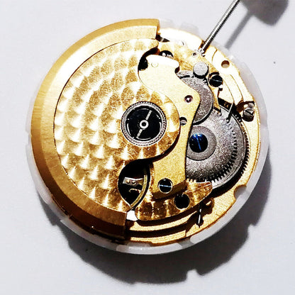 Hangzhou 2350 mechanical watch movement with three hands and single date, featuring golden carved design for precision timekeeping.