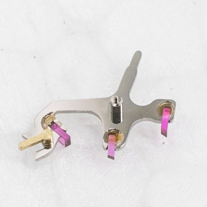 Omega 8500A watch movement pallet fork and escape wheel set, precision components for accurate timekeeping.