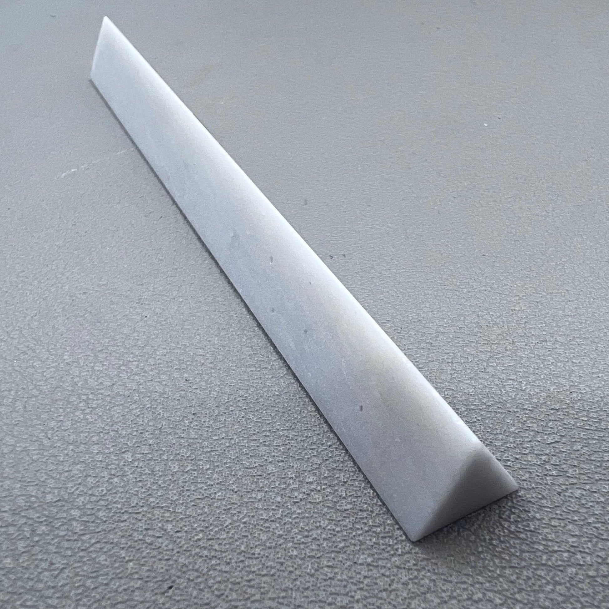Horotec MSA16.013 Arkansas triangular sharpening stone for precise watch tool maintenance and polishing.