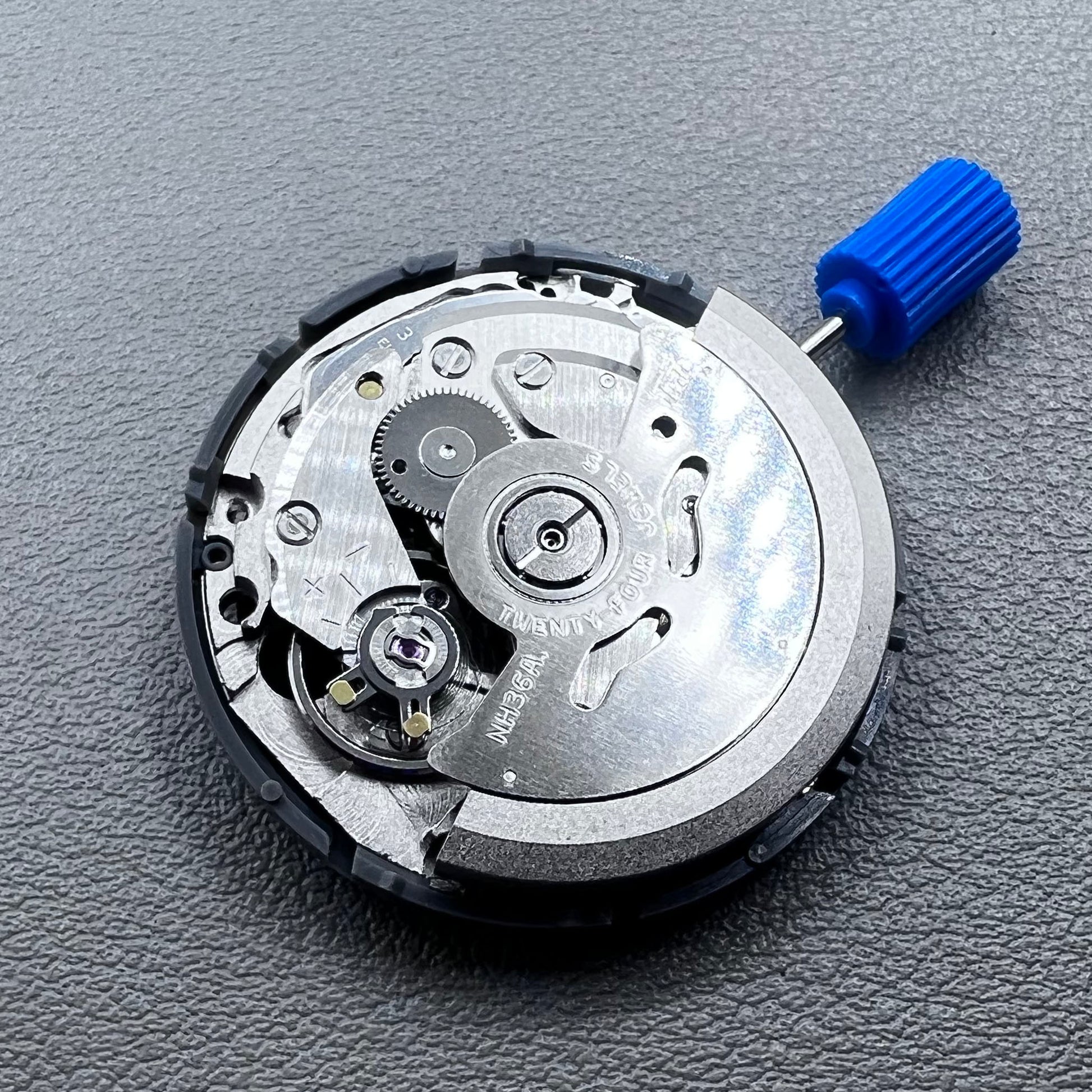 Seiko NH36A automatic movement with black Roman wheel crown, precise watch accessory for mechanical timepieces.