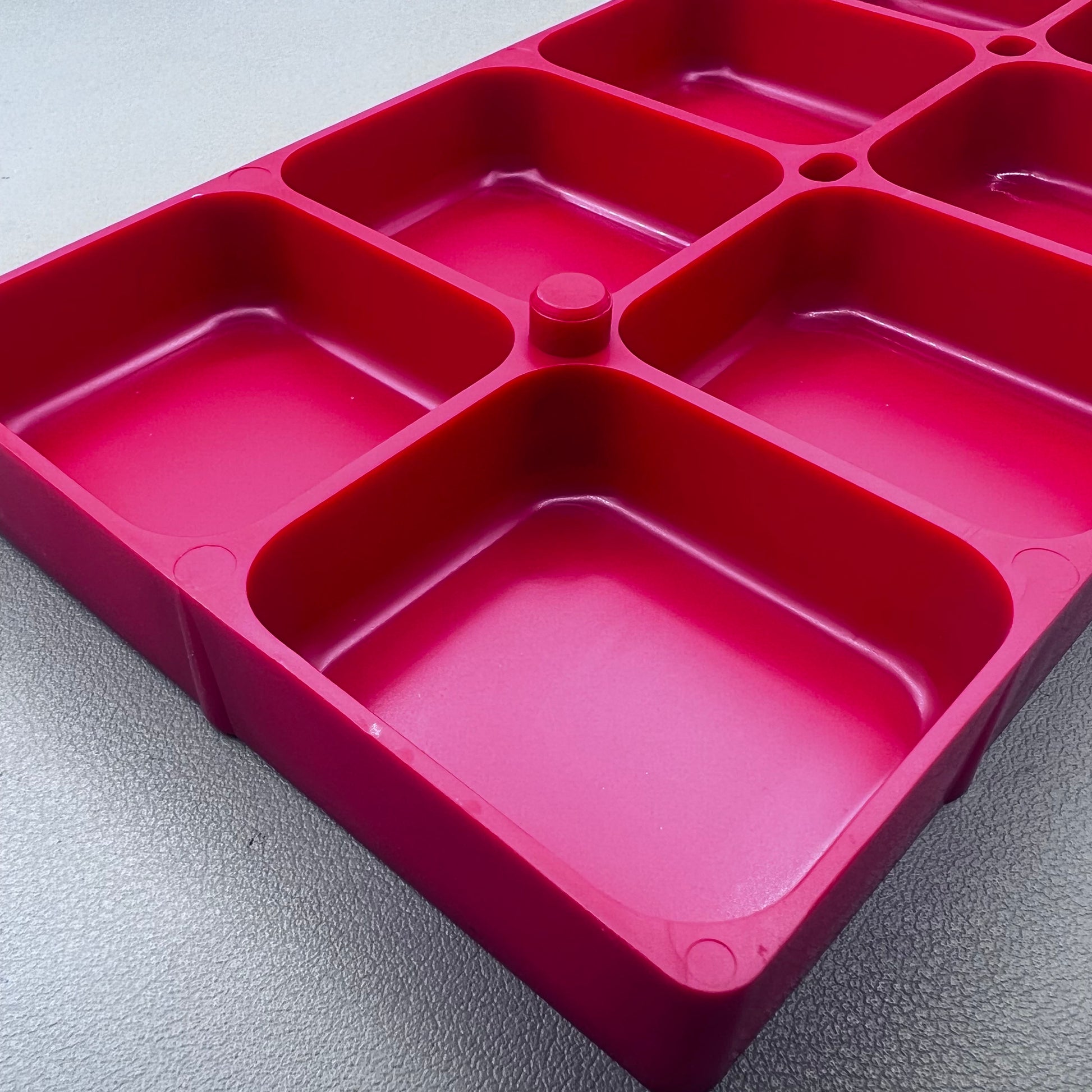 Swiss Horotec red plastic container with 10 compartments for organized watch accessory storage