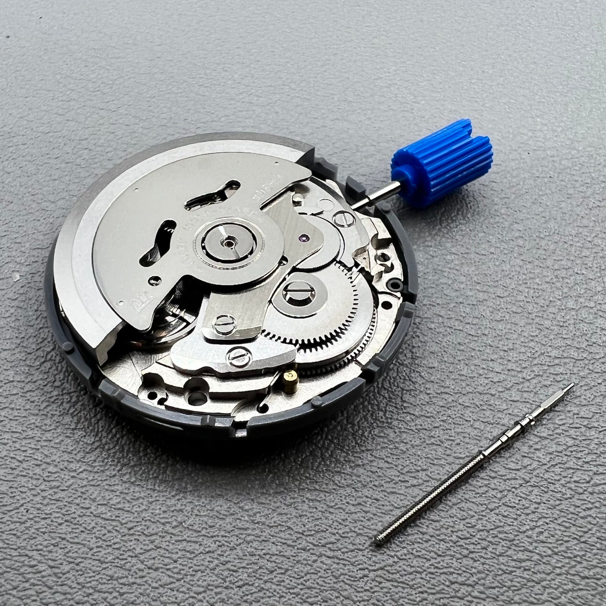 Seiko NH36A watch movement with black day wheel and English font, crown positioned at 3 o'clock