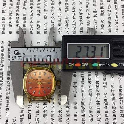 Seagull 27mm gold square watch with manual mechanical movement, elegant ladies accessory on orange background