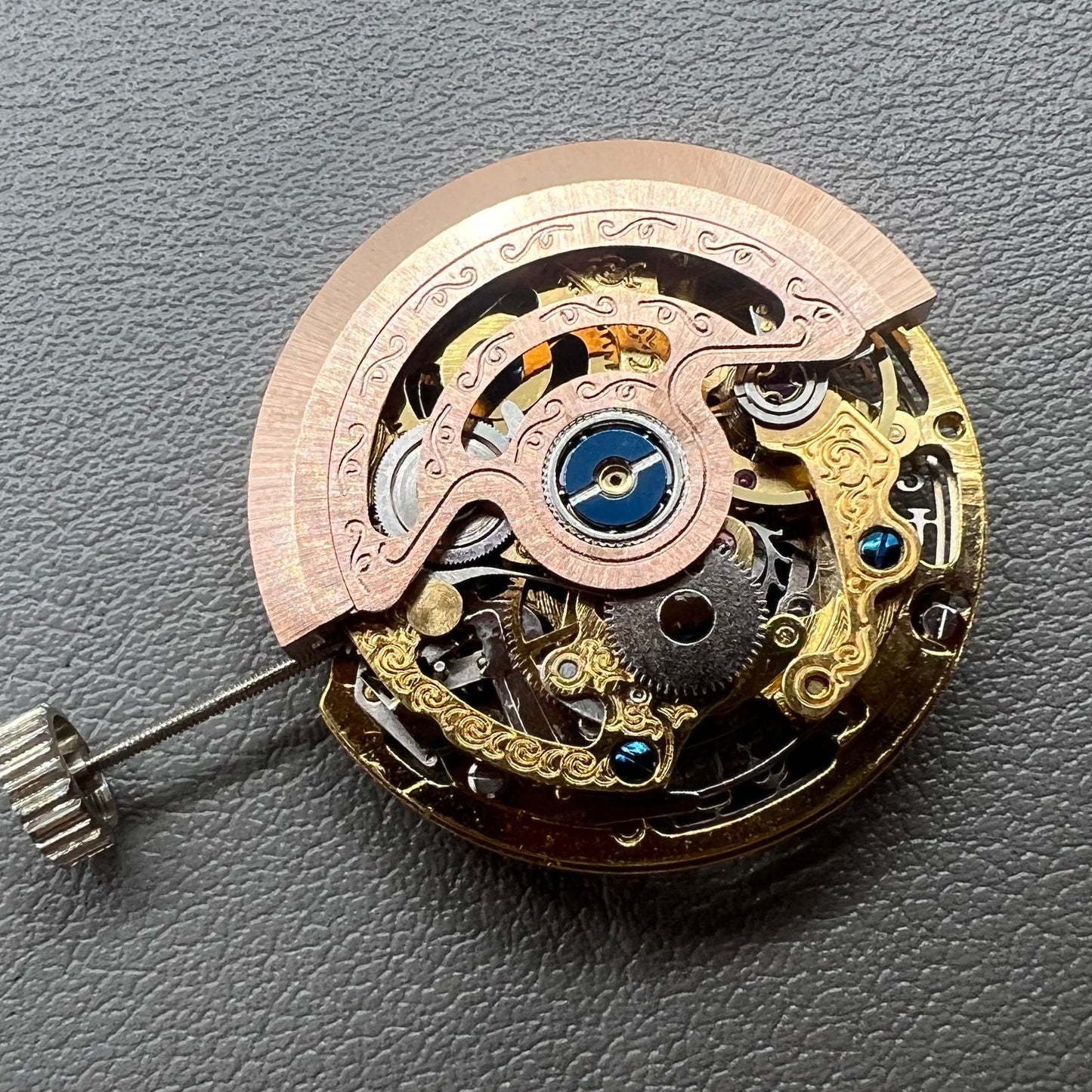 Hangzhou 2189 golden hollow watch movement showcasing intricate mechanical single calendar design.