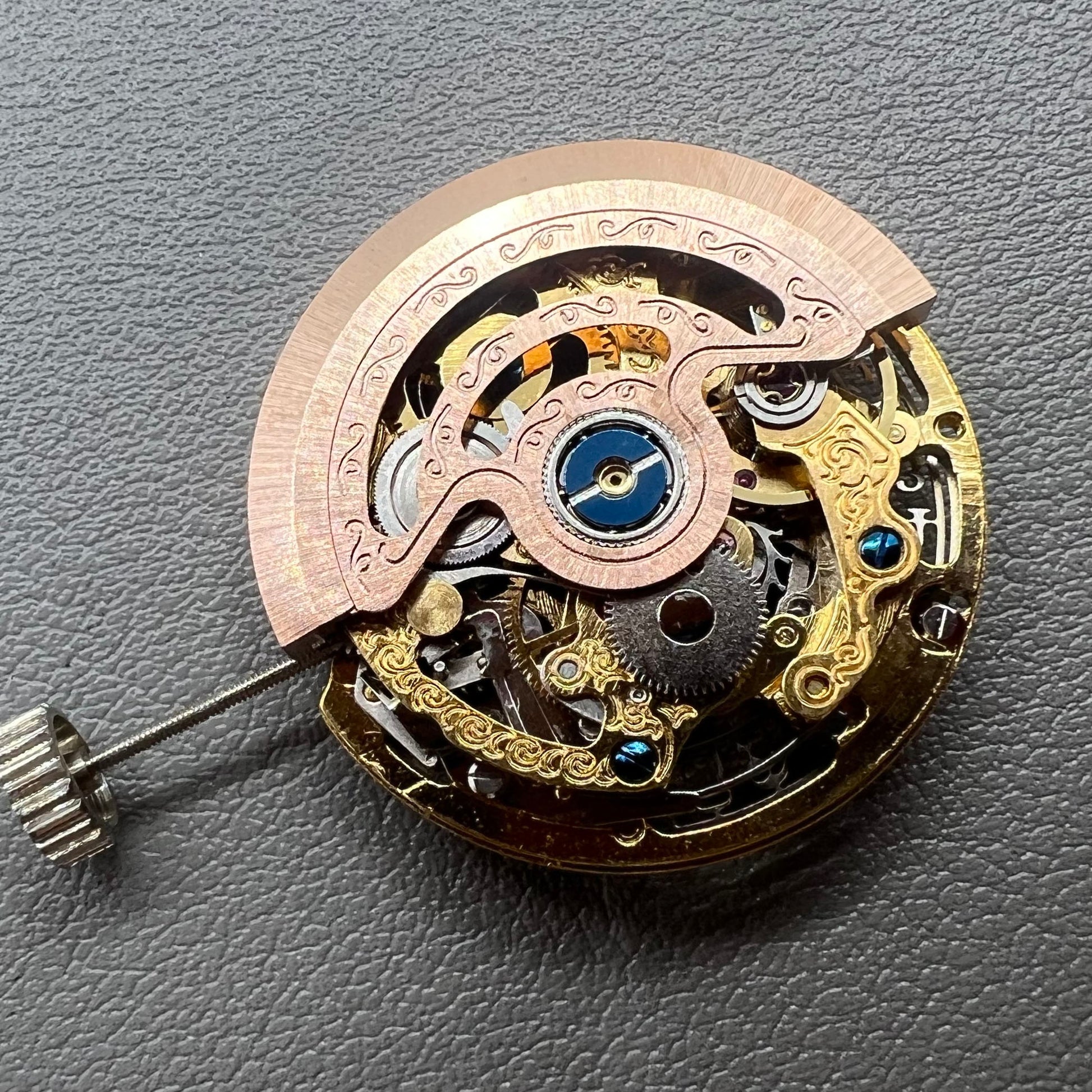 Hangzhou 2189 golden hollow watch movement showcasing intricate mechanical single calendar design.