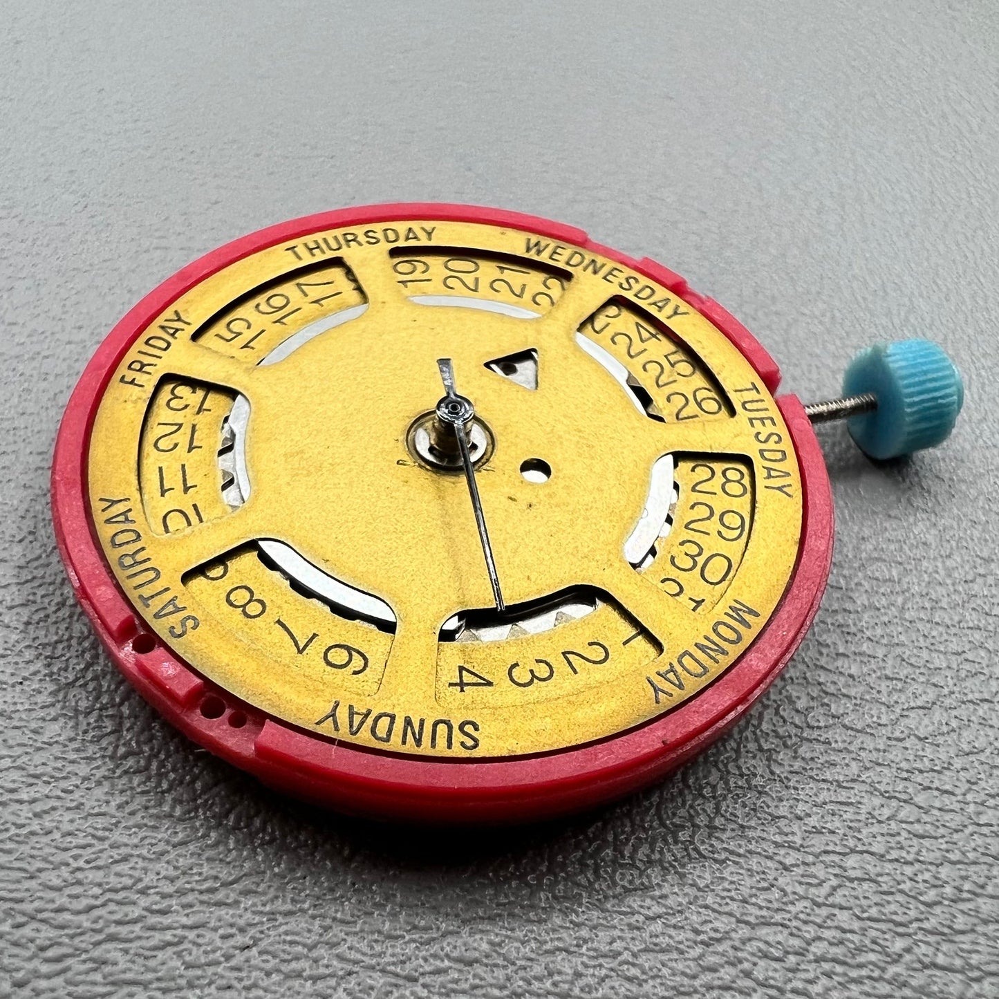 Swiss ISA 1198 watch movement with golden dial, date at 3 o'clock, weekday display, premium watch accessory.