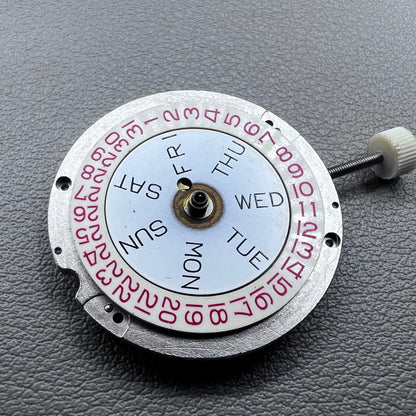 Disassembled Swiss RONDA MATIC 1217-21 manual winding watch movement showcasing intricate components.