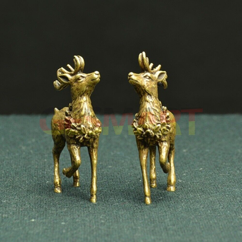 Hand-carved copper Sika deer figurines with bronze finish, elegant decorative trinkets.