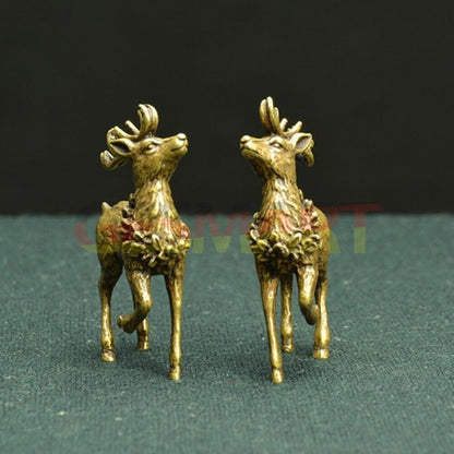 Hand-carved copper Sika deer figurines with bronze finish, elegant decorative trinkets.