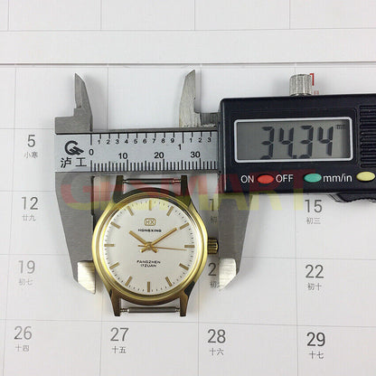 33mm manual mechanical watch with golden nails and silver dial in round golden case.