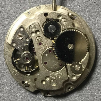 Disassembled Swiss Made RONDA MATIC 1217-21 manual winding watch movement parts for precise repair.