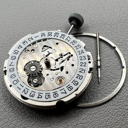 Close-up of Japan Miyota 8200 movement with single date display at 3 o'clock on watch accessory.