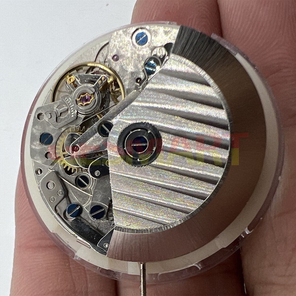 Asian 7750 Automatic Chronograph watch movement with white calendar at 4:30 and small seconds at 9, precision ETA 7750 design.