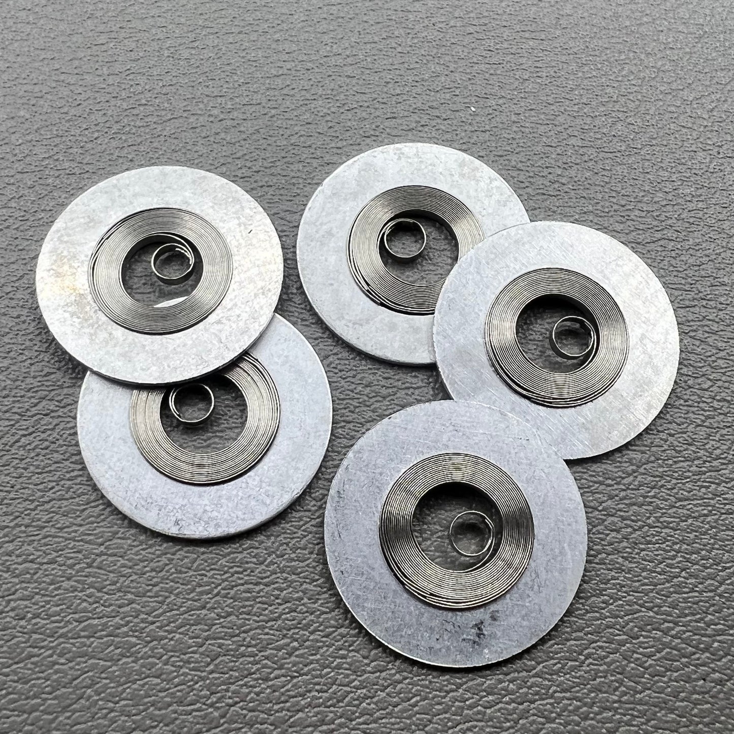 1. Silver mainspring set for 7S26#180 movement, compatible with various watch models.  