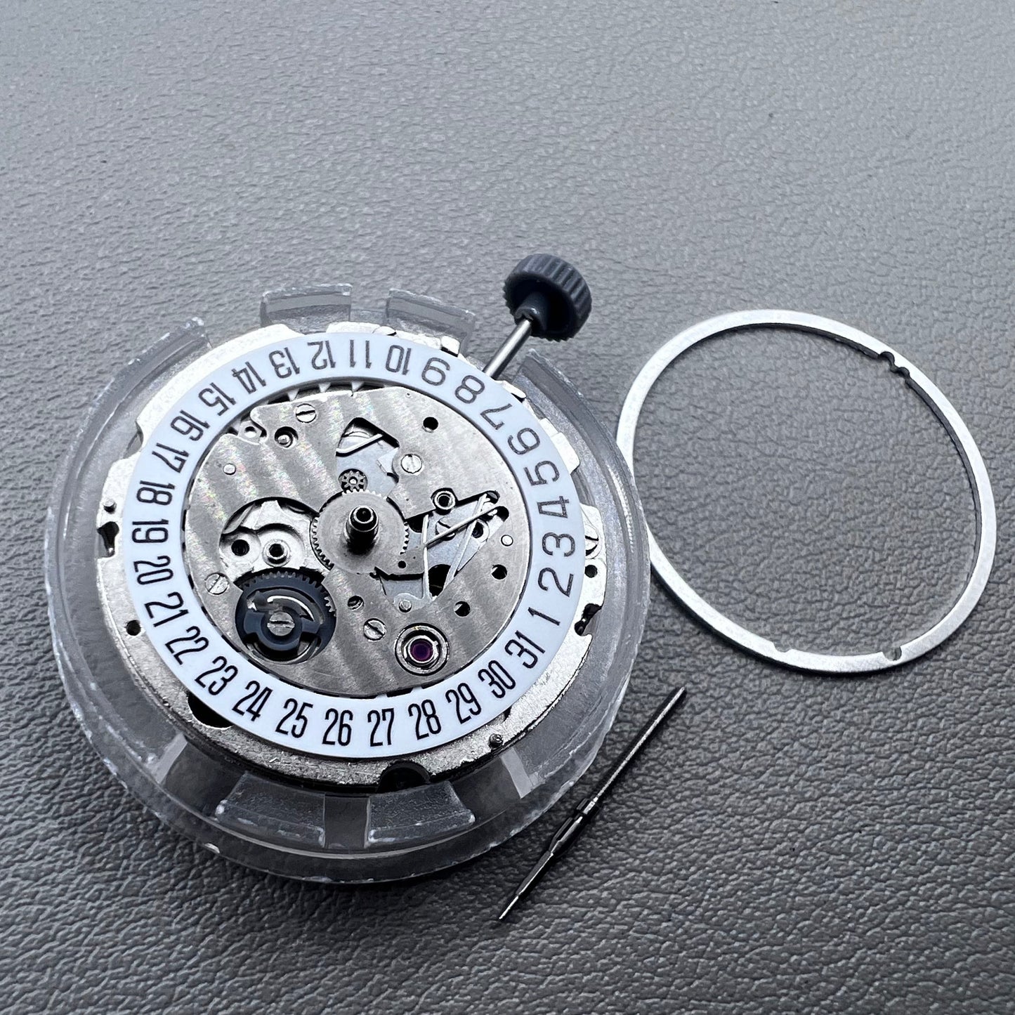 Japan Miyota 8215 silver plated automatic watch movement with date at 6 o?clock, precise mechanical design.