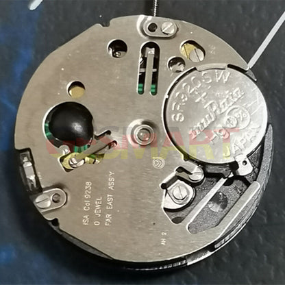 Watchmakers ISA 9238 silver quartz watch movement replacement part for repair.