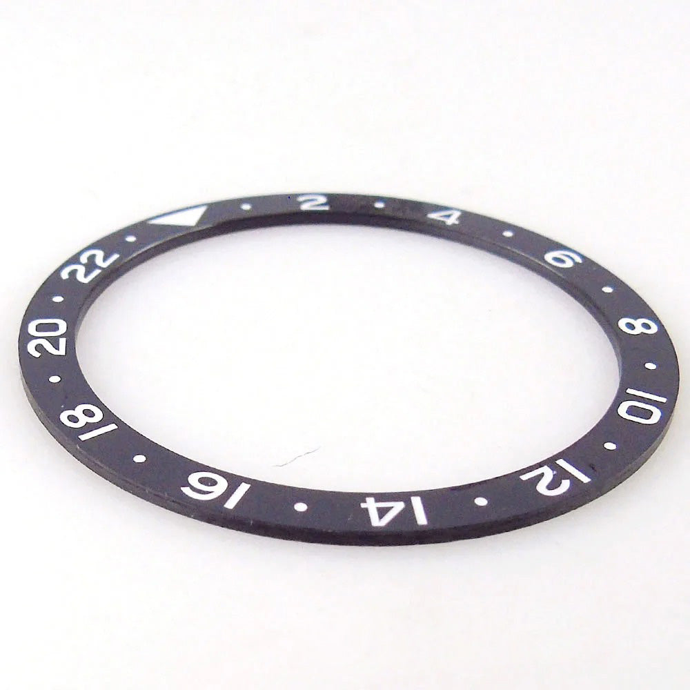 Black 38x31.5mm ceramic GMT bezel insert for SKX NH34 wristwatch, durable watchmaker part.
