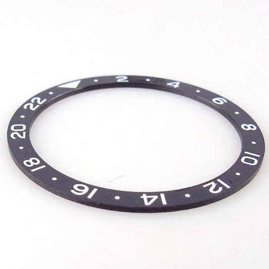 Black 38x31.5mm ceramic GMT bezel insert for SKX NH34 wristwatch, durable watchmaker part.