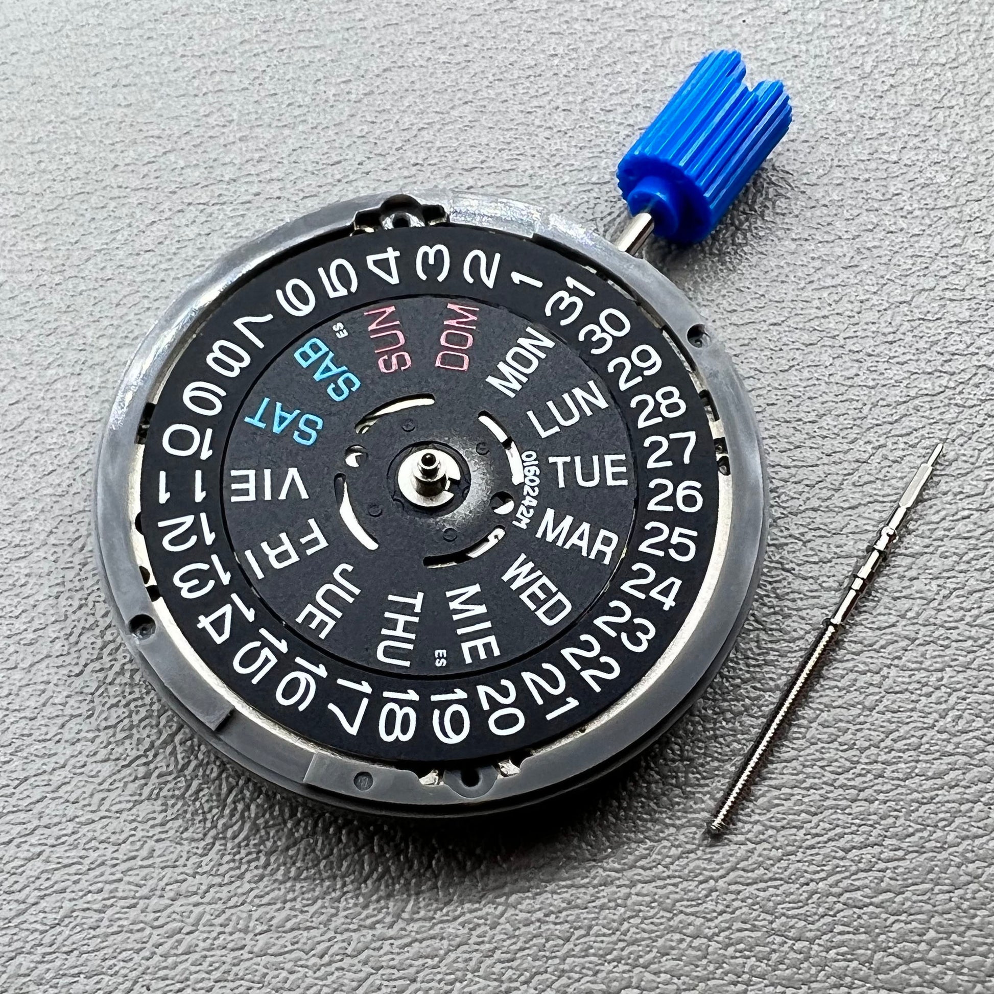 Seiko NH36A watch movement with black day wheel and English font, crown positioned at 3 o'clock
