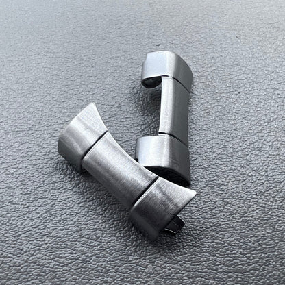 Set of 2 polished silver steel curved end links, 20x10mm, for secure watch band attachment.