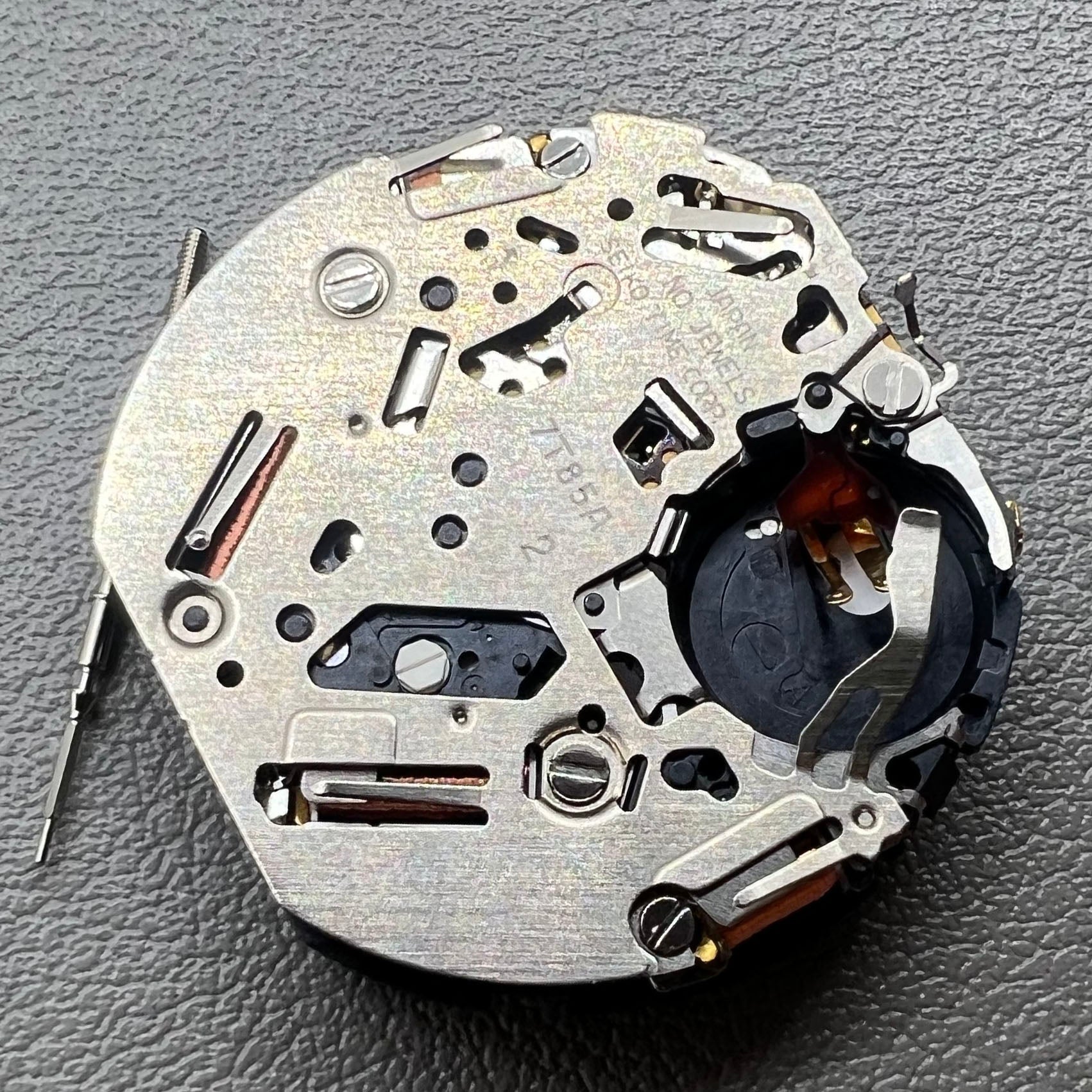 Seiko 7T85A quartz watch movement, precise craftsmanship made in Japan for reliability.