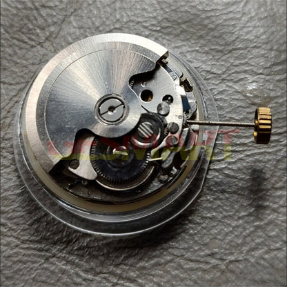 China Made HZ2350 automatic watch movement showing double calendar function and precise mechanical details.