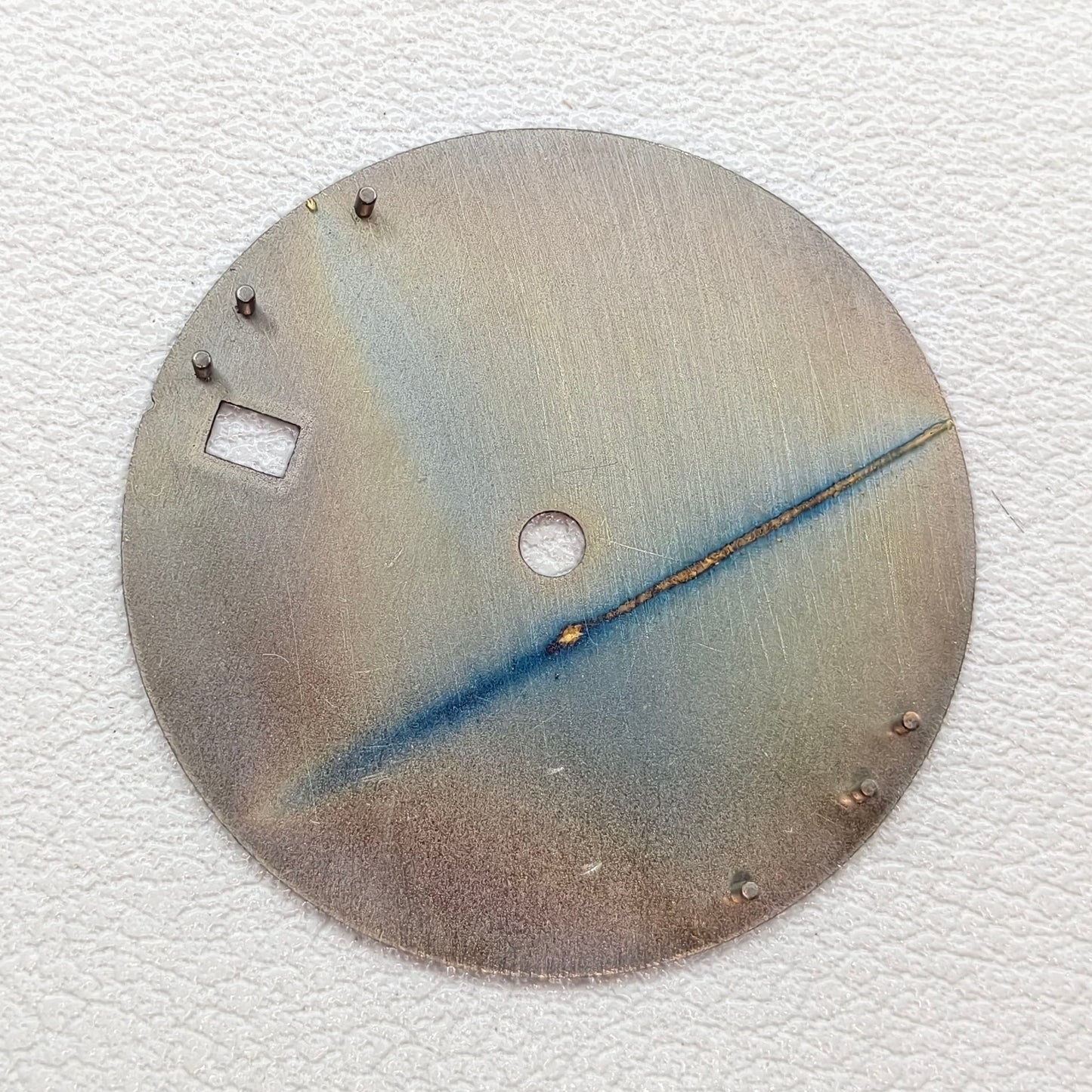 watch dial with R logo