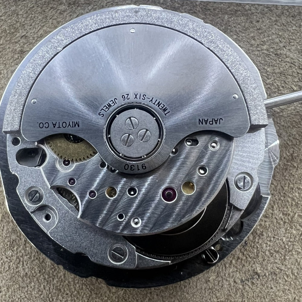 Miyota 9130 automatic mechanical watch movement with date display at 6 o'clock, precision engineering.